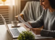 Cozy workspace with a person reviewing credit repair documents on a laptop