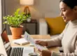 Cozy workspace with a person reviewing credit repair documents on a laptop