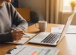 Cozy workspace with a person reviewing credit report emphasizing financial improvement e8c49e67 4b56 45eb 9e8e 424bf13cc537 1.avif